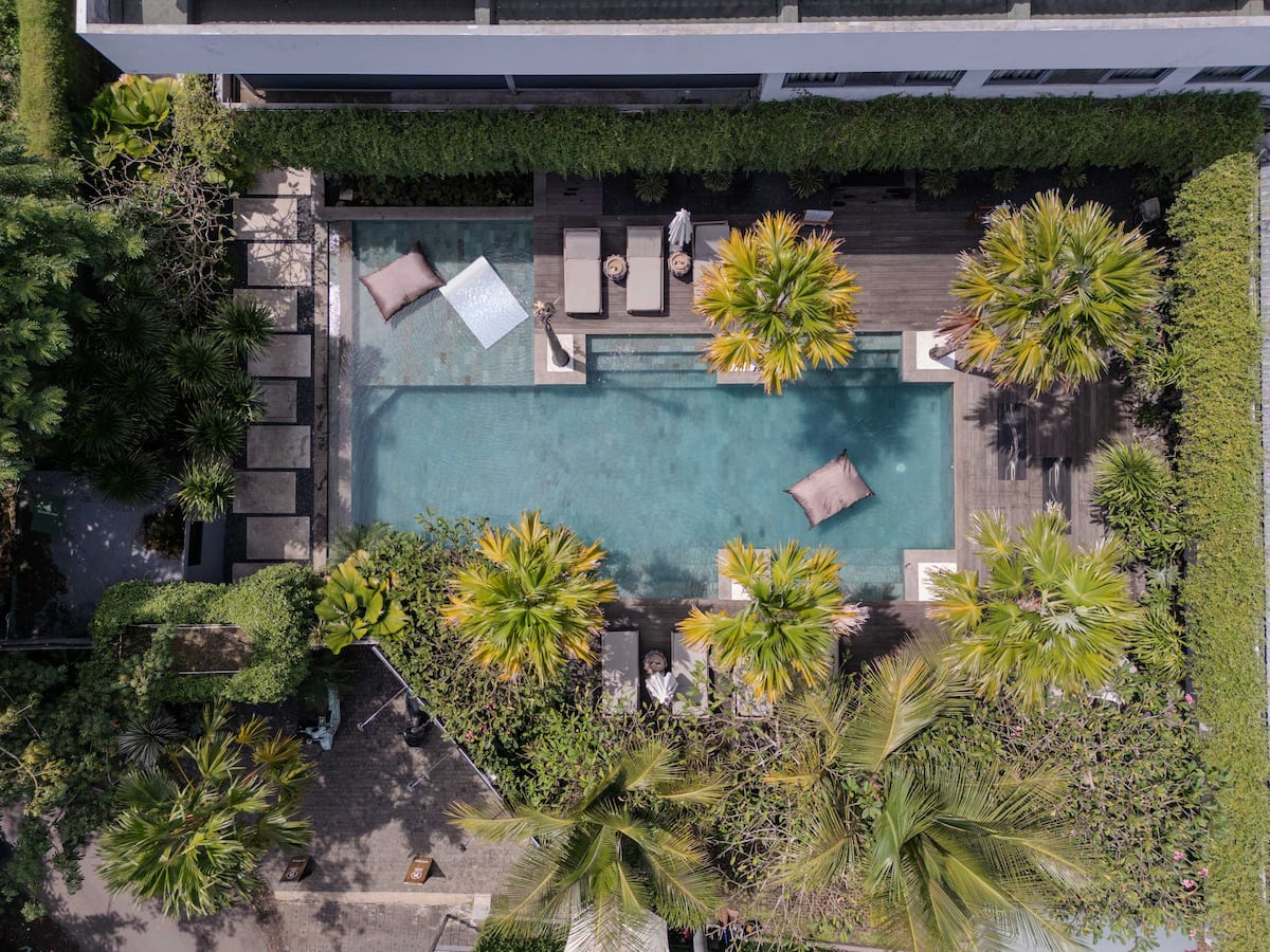 Calm pool and lounge setting at Address Bali Villa