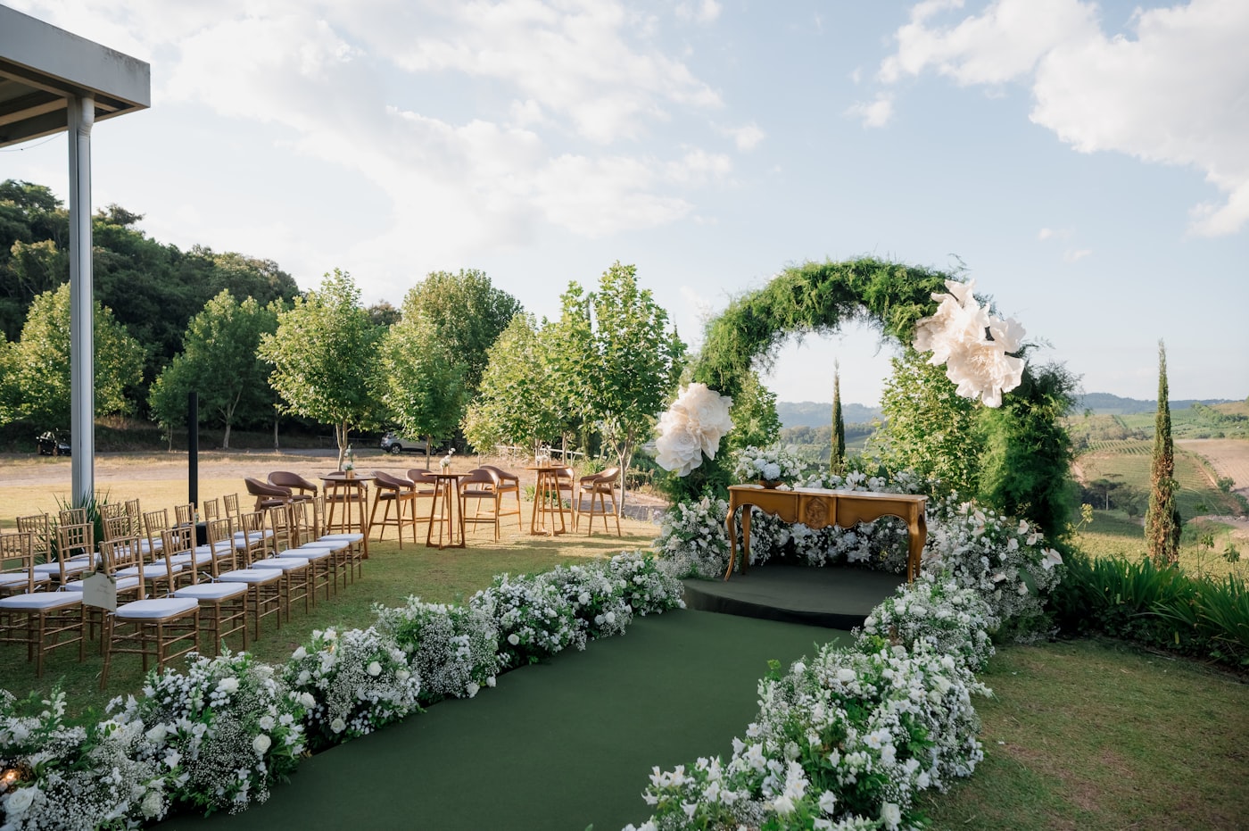 Floral wedding ceremony arch for an intimate villa celebration